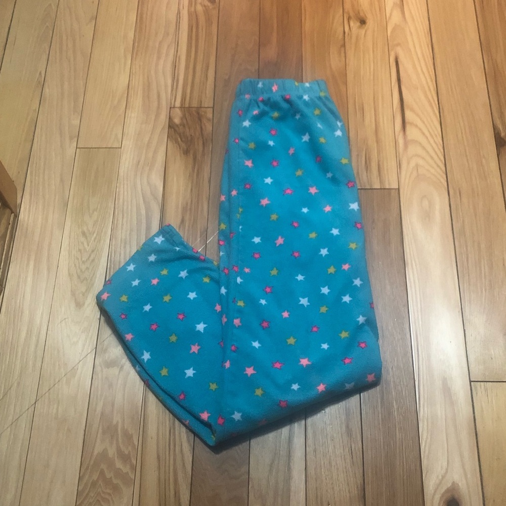 Soft blue pajama pants with stars on them plus they are a extra large in girls.